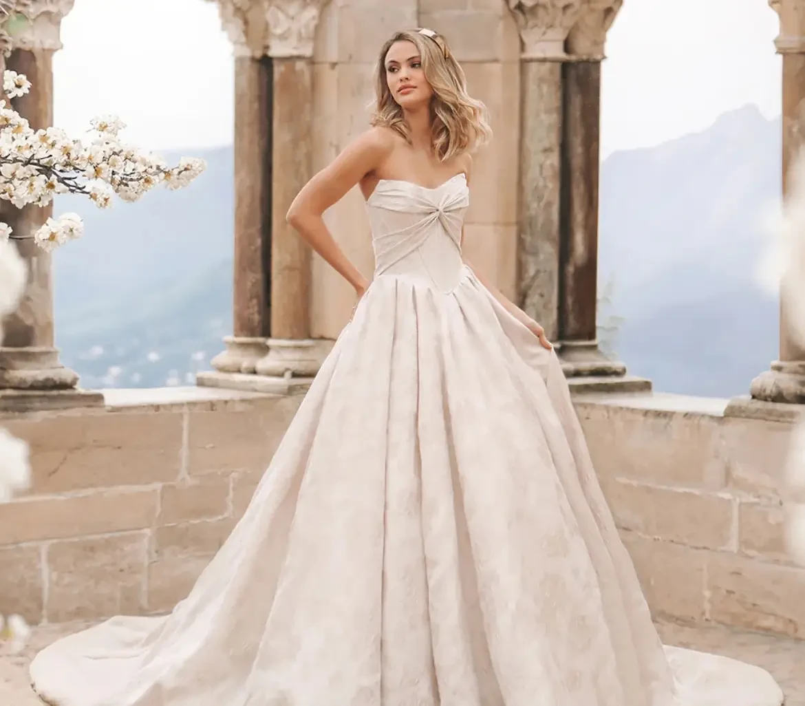 Model wearing a bridal gown by Allure Bridals Fall 2025 collection