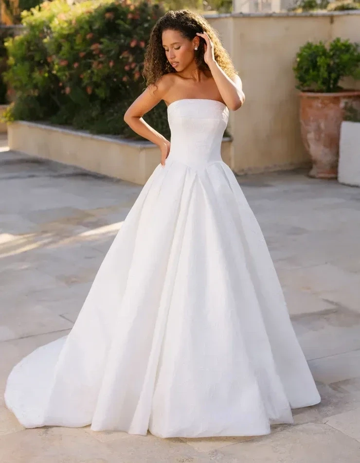 Model wearing a bridal gown by Allure Bridals Fall 2025 collection