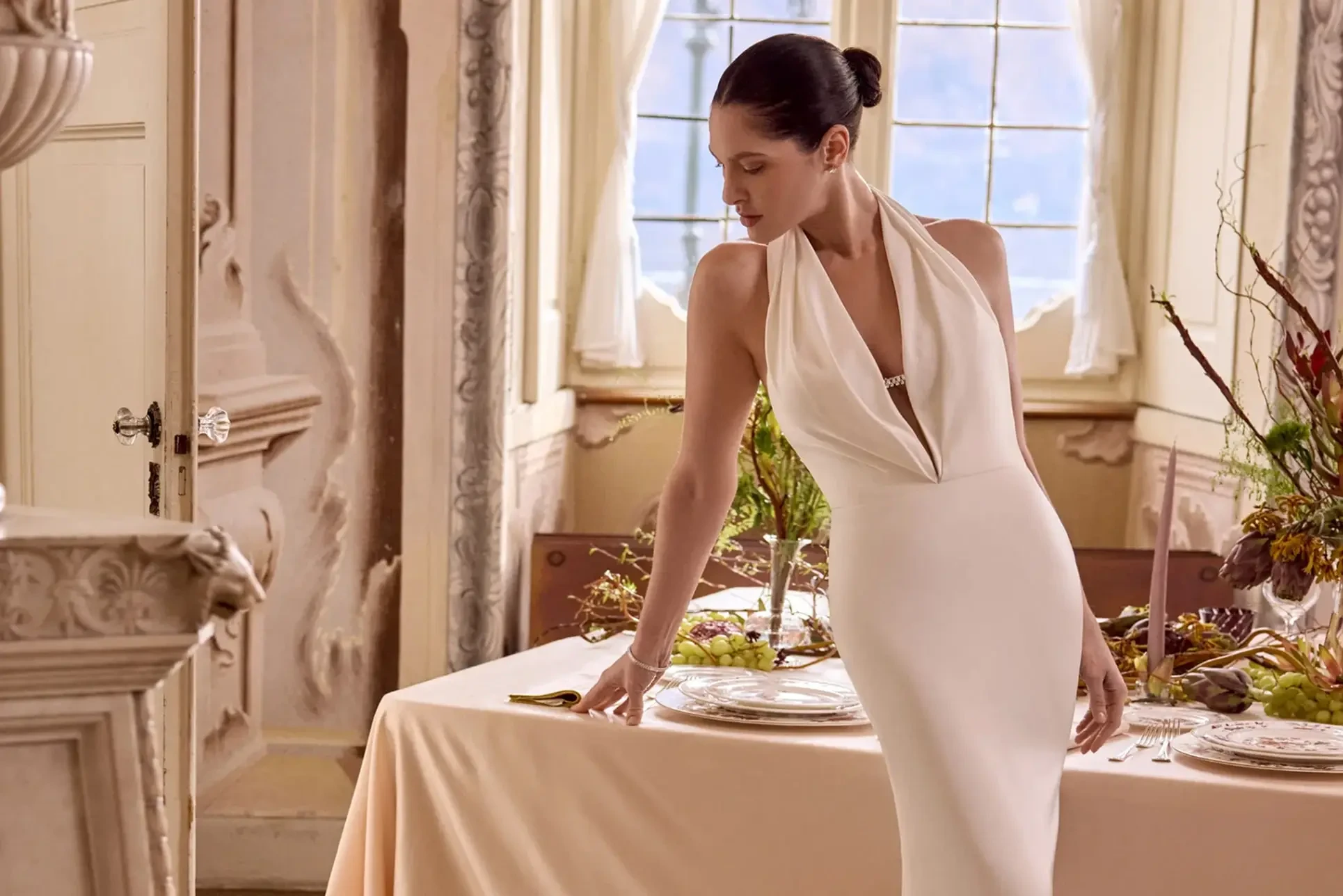 Model wearing a white gown