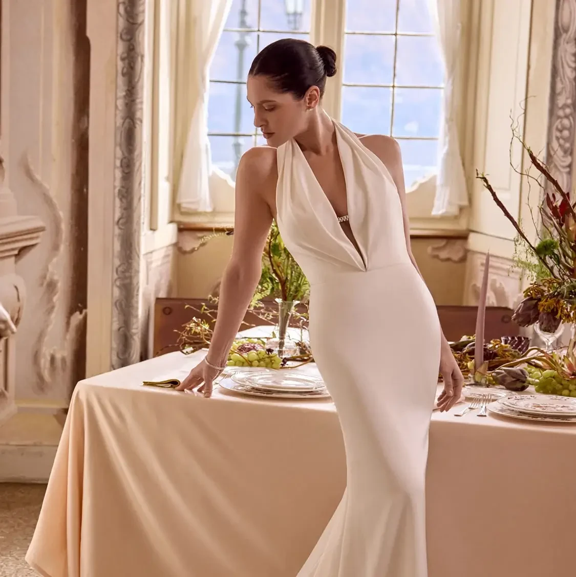 Model wearing a white gown. Mobile image