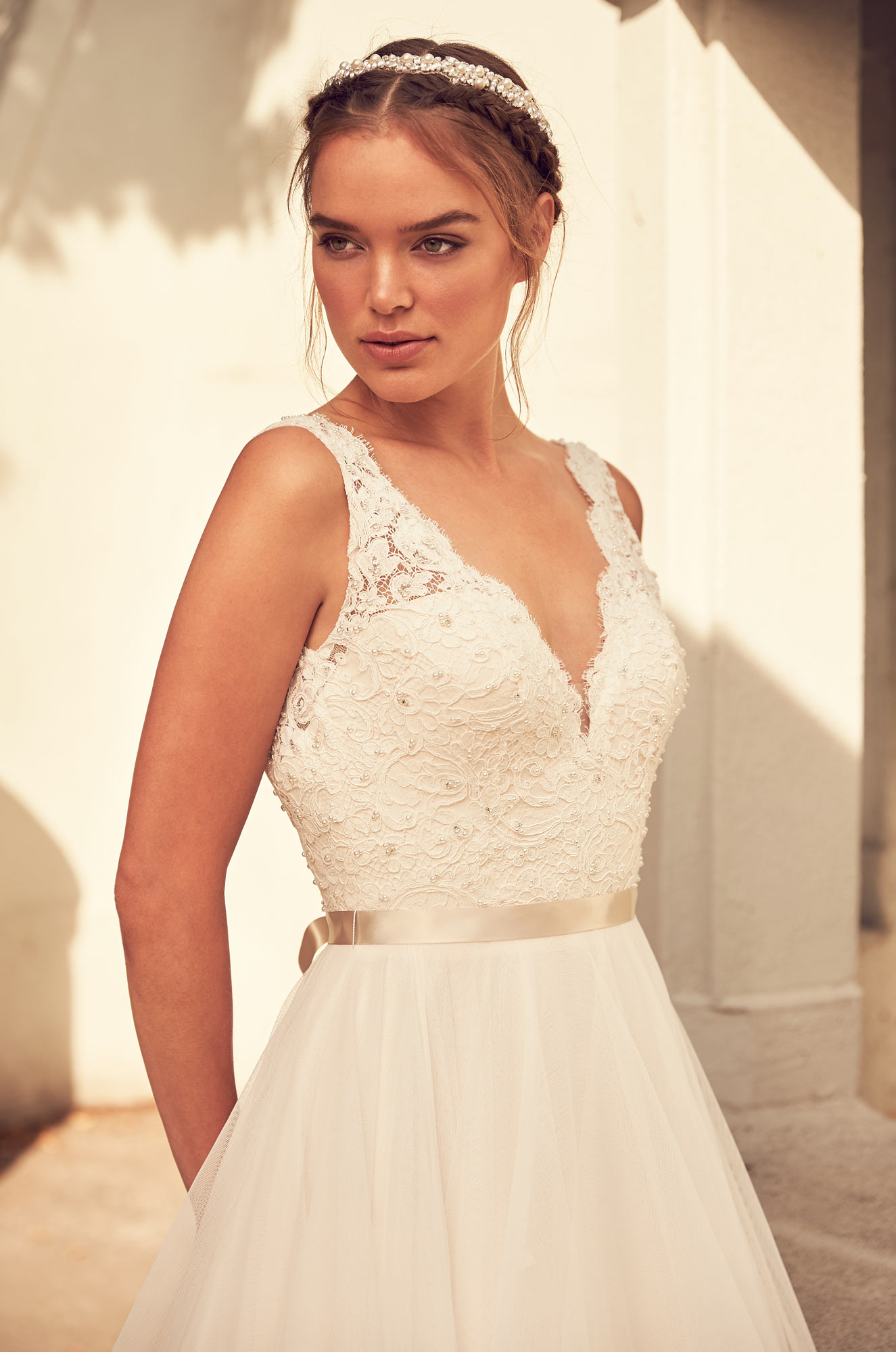 Model wearing a white dress 22